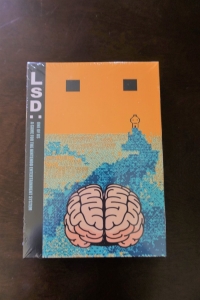 LSD: One of Us Box Art